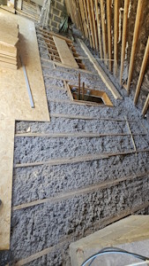 Aménagement d'un grenier à Overijse - Isolation du sol avec un soufflage ouvert d'ouate de cellulose IQ3