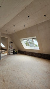 Aménagement d'un grenier à Overijse - Fin du gyproc dans la chambre aménagée (vue 2)